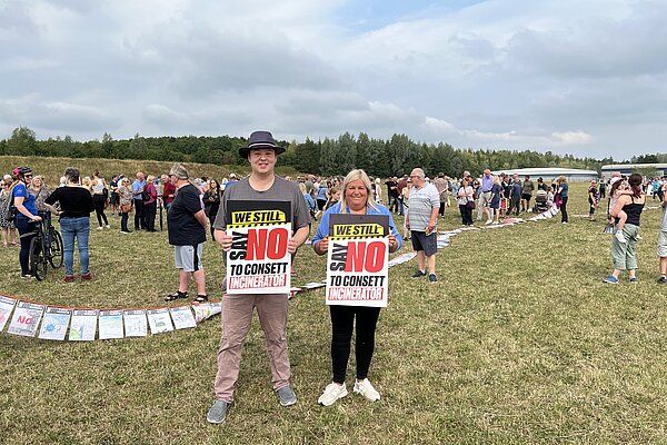 Dom and Kathryn holding signs for Say no to Consett Incinerator