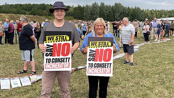 Dom and Kathryn holding signs for Say no to Consett Incinerator